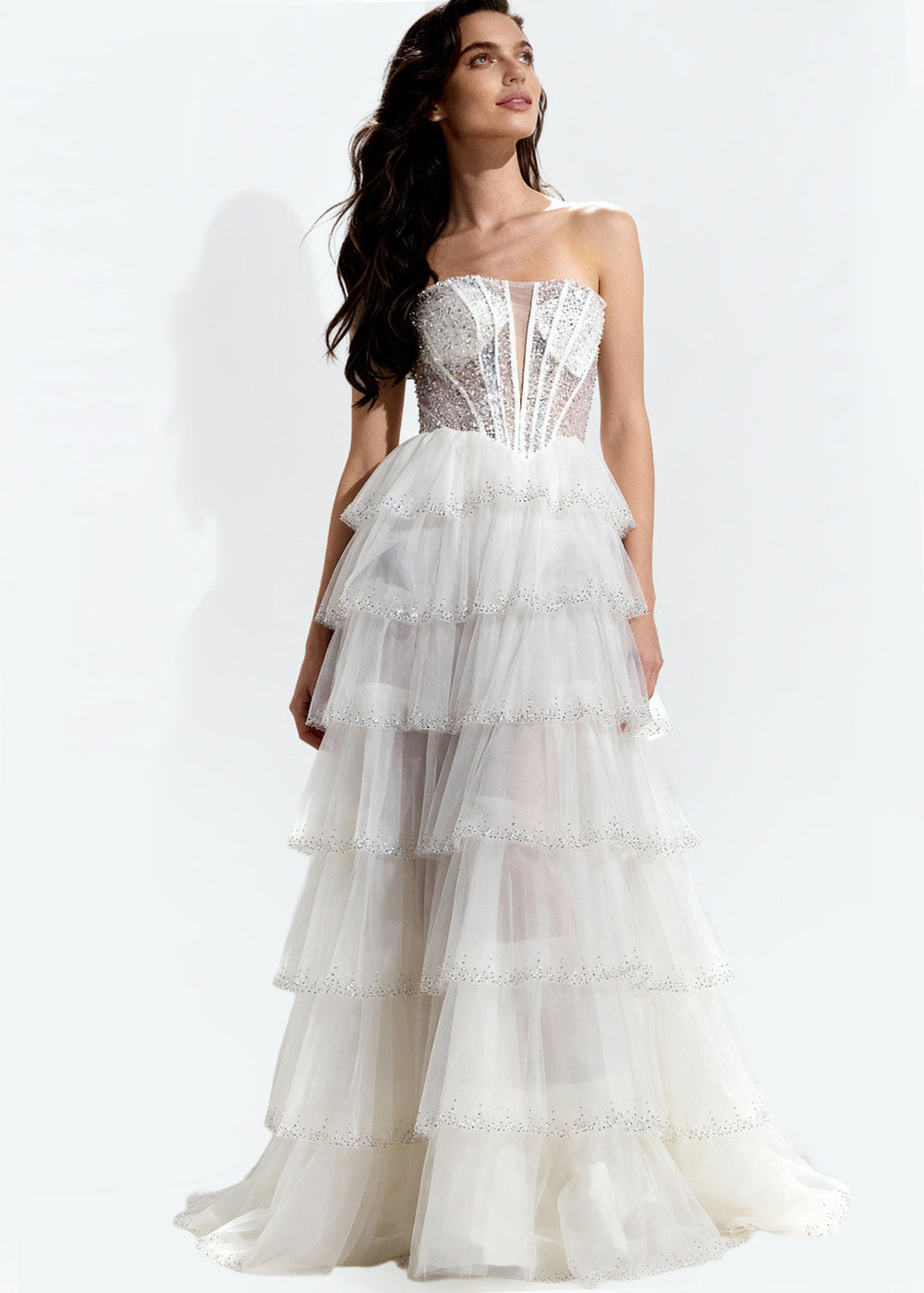 Jovani 47290 Strapless off-white prom dress with tiered ruffles and beaded bodice, front view.