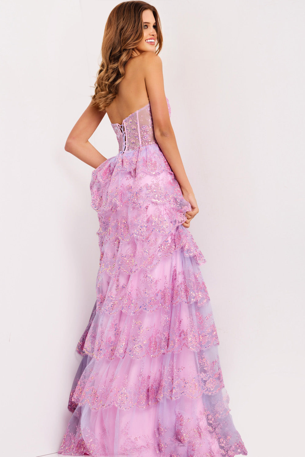 Jovani 47294 Lilac formal gown with layered ruffles and lace-up back, back view.
