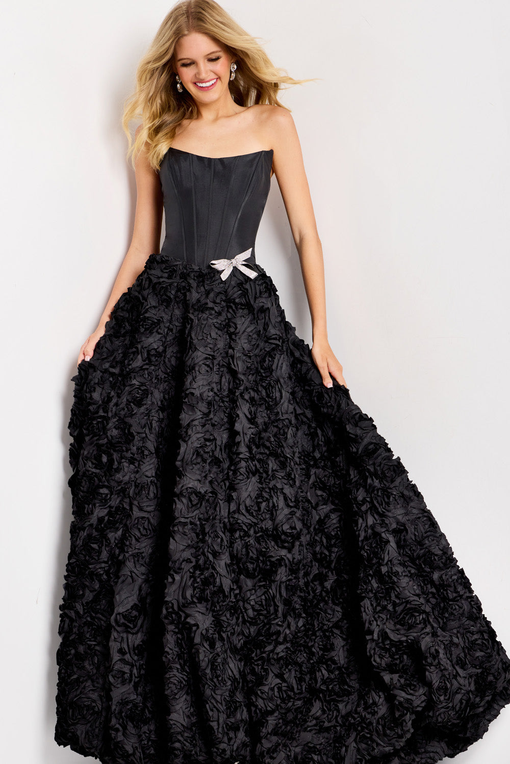 Jovani 47695 Strapless black prom dress with a floral ballgown skirt and jeweled waist detail.