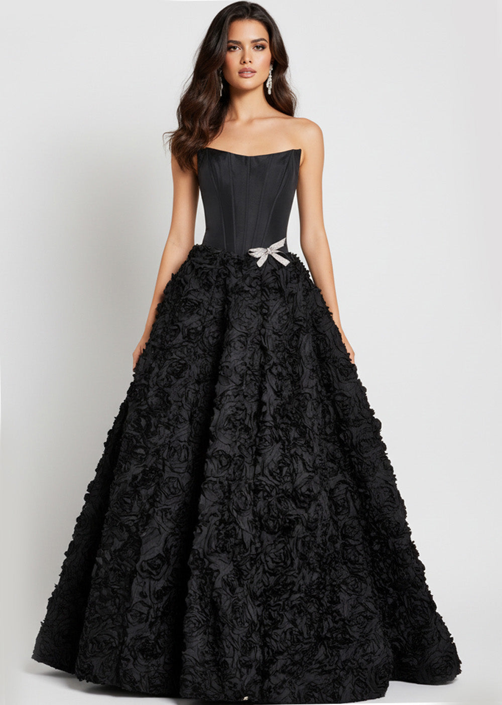 Jovani 47695 Black ballgown prom dress with floral texture and a sparkling bow detail.