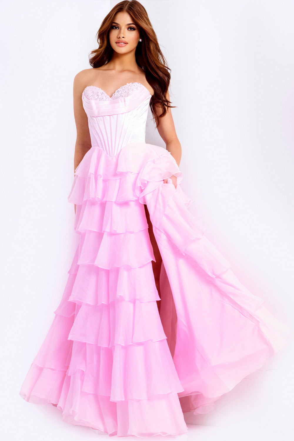 Jovani 47762 Pink strapless prom dress with ruffled layers and a high slit, front view.