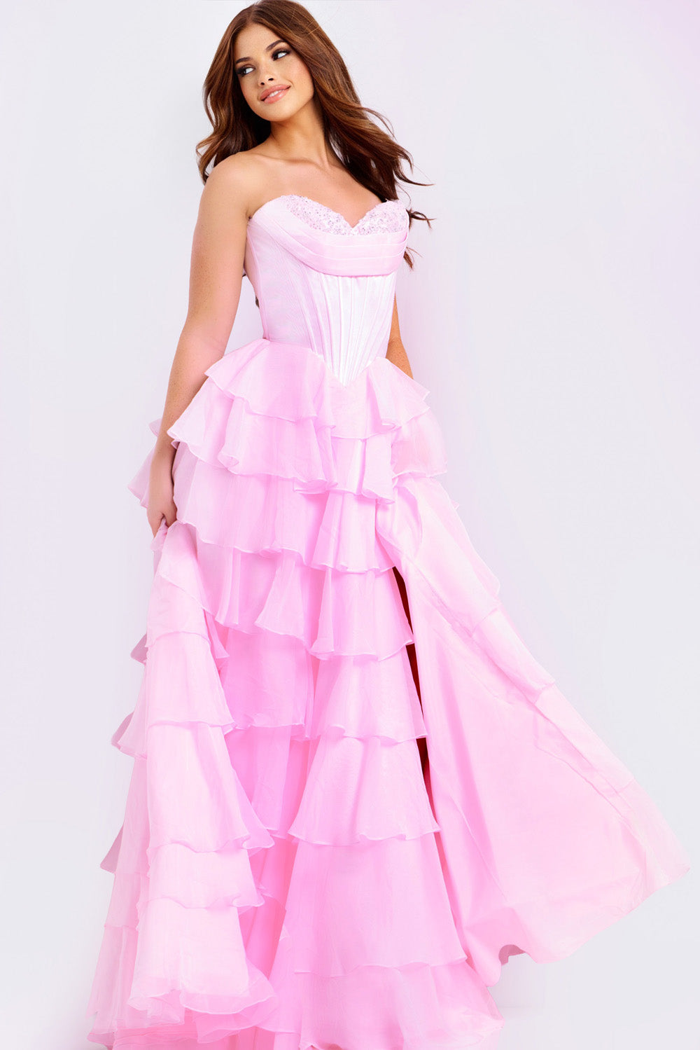 Jovani 47762 Pink strapless prom dress with ruffled layers and a high slit.