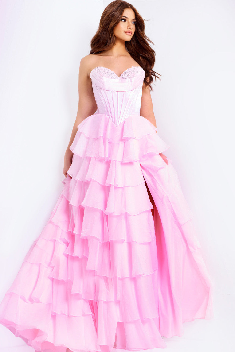 Jovani 47762 Pink strapless prom dress with layered ruffles and a side slit.