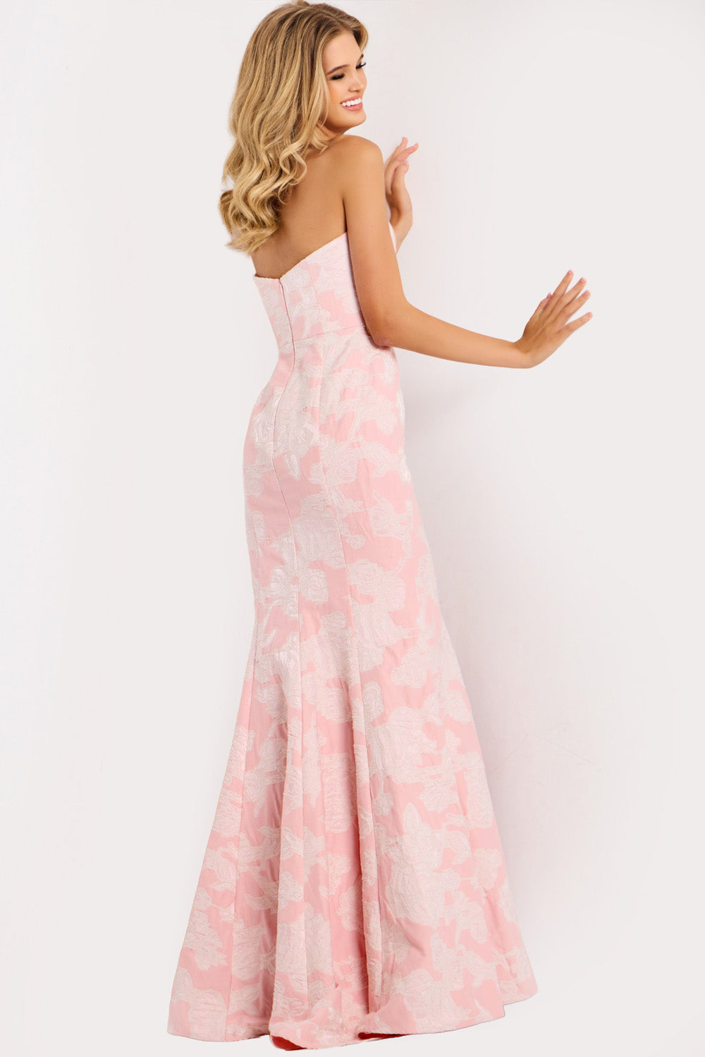 Jovani 48260 Blush mermaid prom dress with a stunning lace-up back, side view.