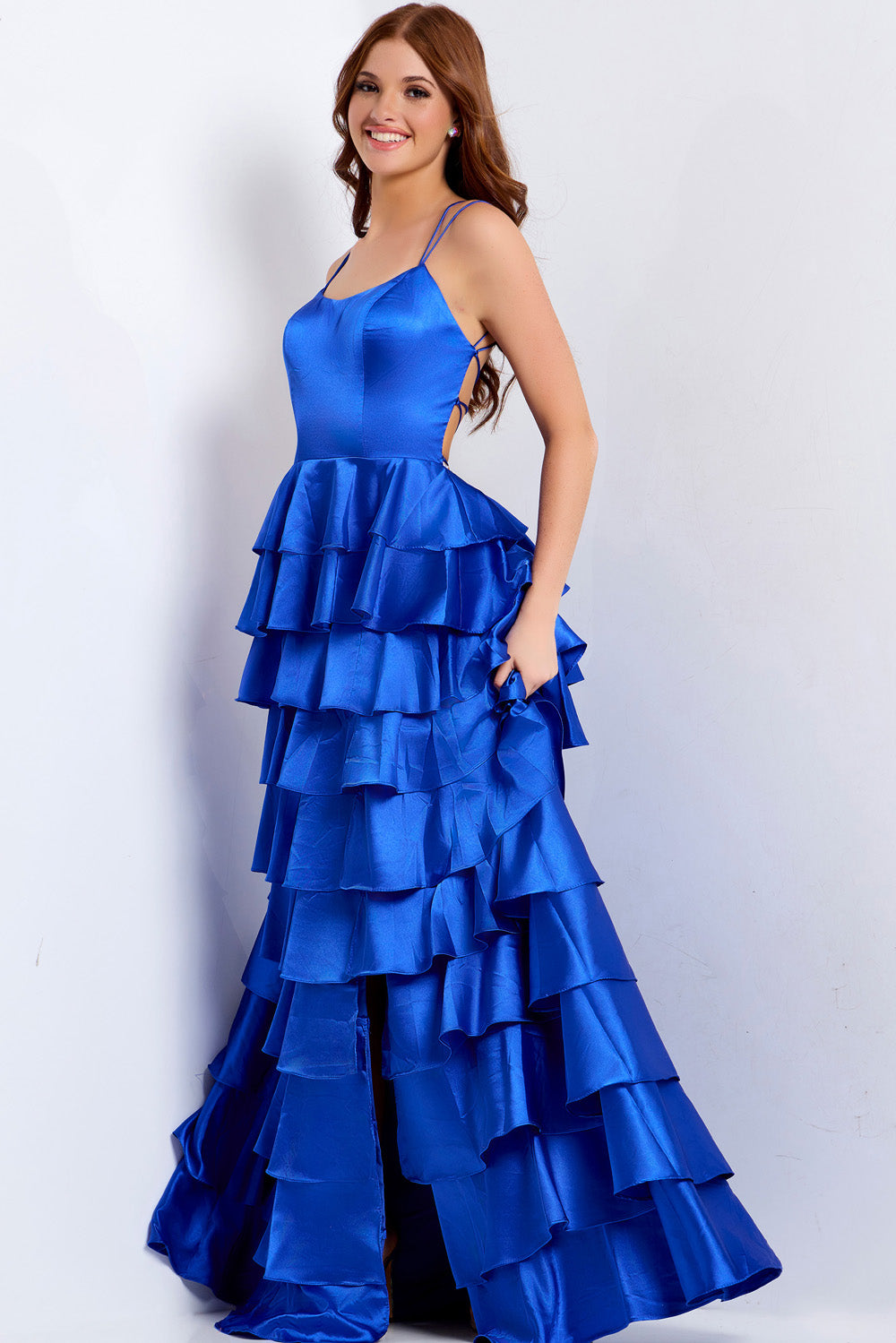 Jovani 48295 Blue ruffled prom dress with a fitted bodice and side slit, side view.