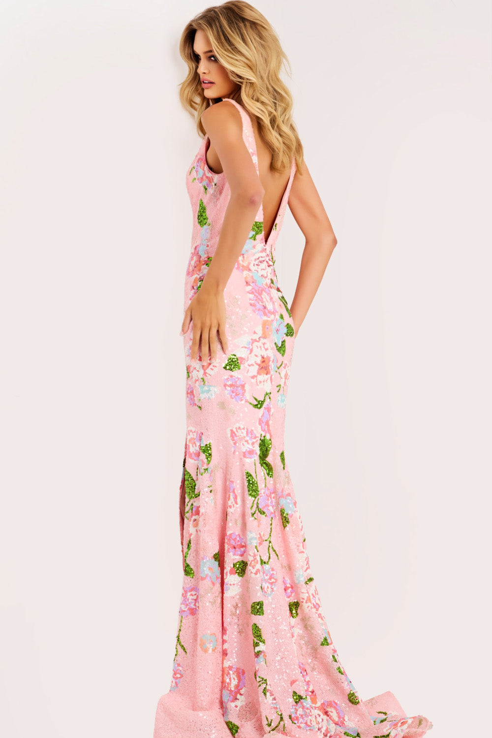 Jovani 48636 Pink mermaid prom dress with floral sequins and a low back, side view.