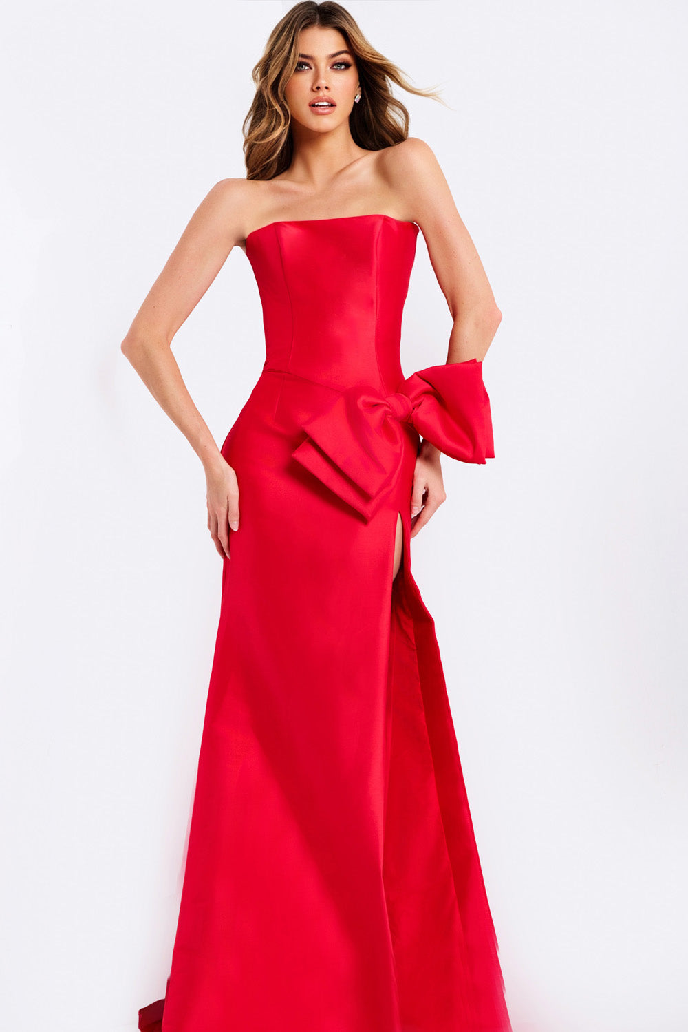 Jovani 49195 Red fitted prom dress with a side slit and dramatic bow detail.