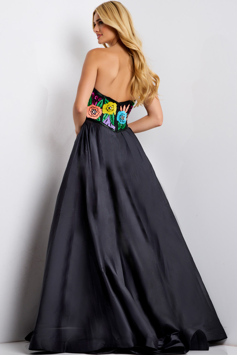 Jovani 49233 Black multi formal gown with colorful beaded bodice and A-line silhouette, back view.