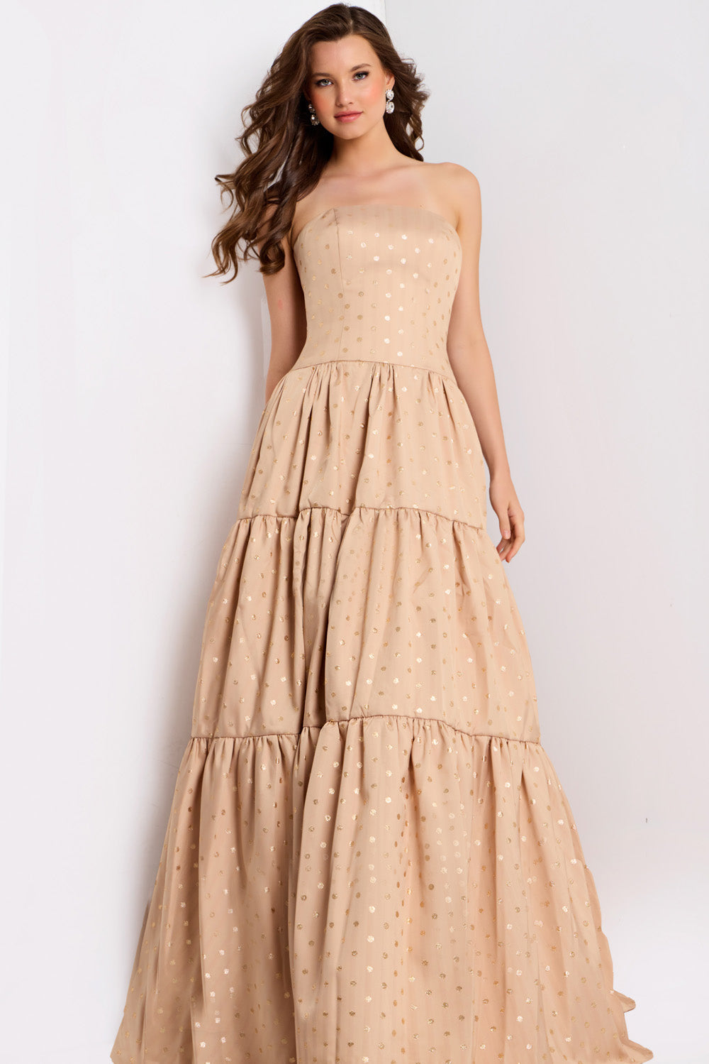 Jovani 49341 Strapless gold formal gown with tiered skirt and shimmering polka dots, front view.