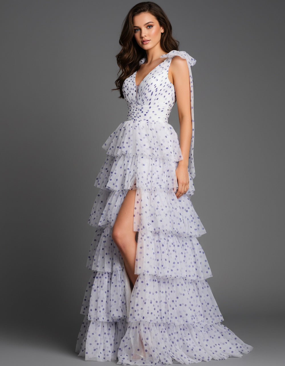 Jovani 49358 Off white and purple tiered prom dress with a high slit and plunging neckline.