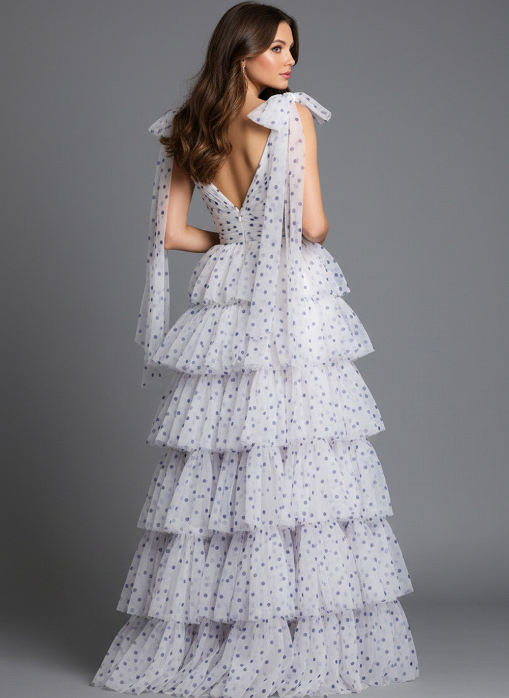 Jovani 49358 Off white and purple tiered prom dress with bow straps and a deep V-back.