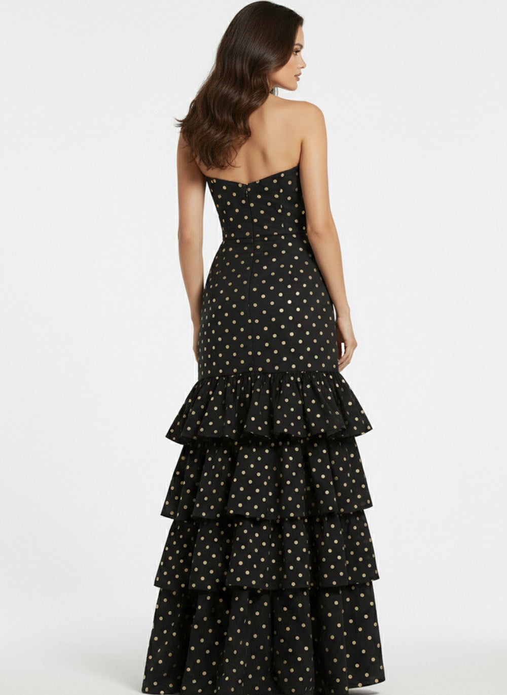 Jovani 49419 Black mermaid prom dress with gold polka dots and ruffled hem, back view.