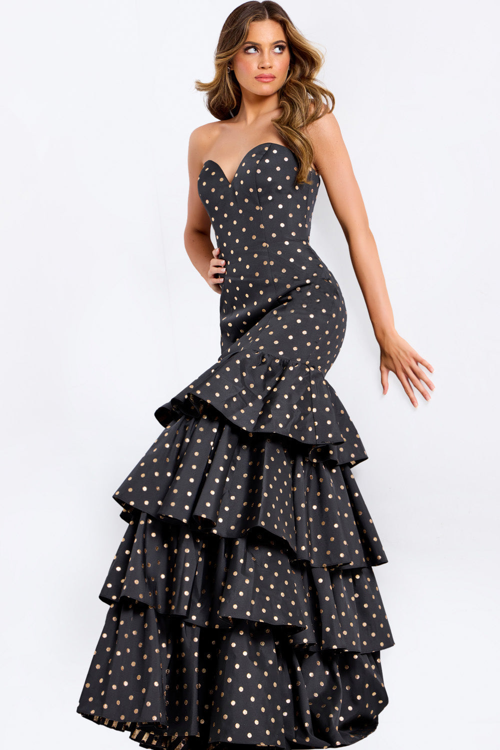 Jovani 49419 Black mermaid prom dress with gold polka dots and ruffled hem.