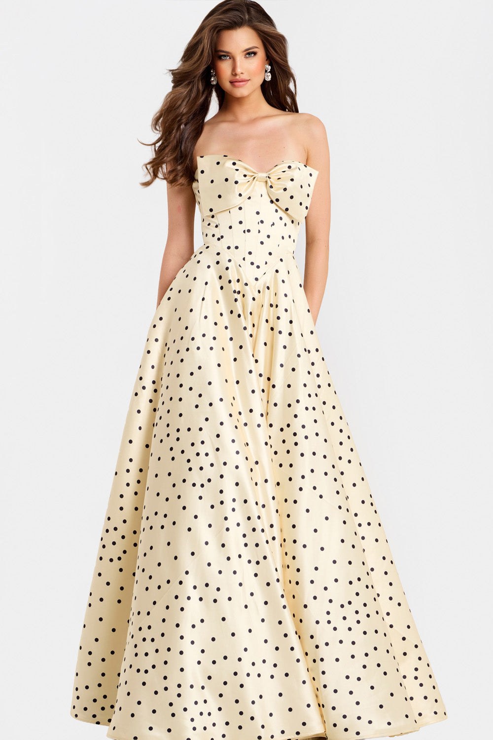Jovani 49775 Champagne A-line prom dress with a bow detail and polka dot pattern.