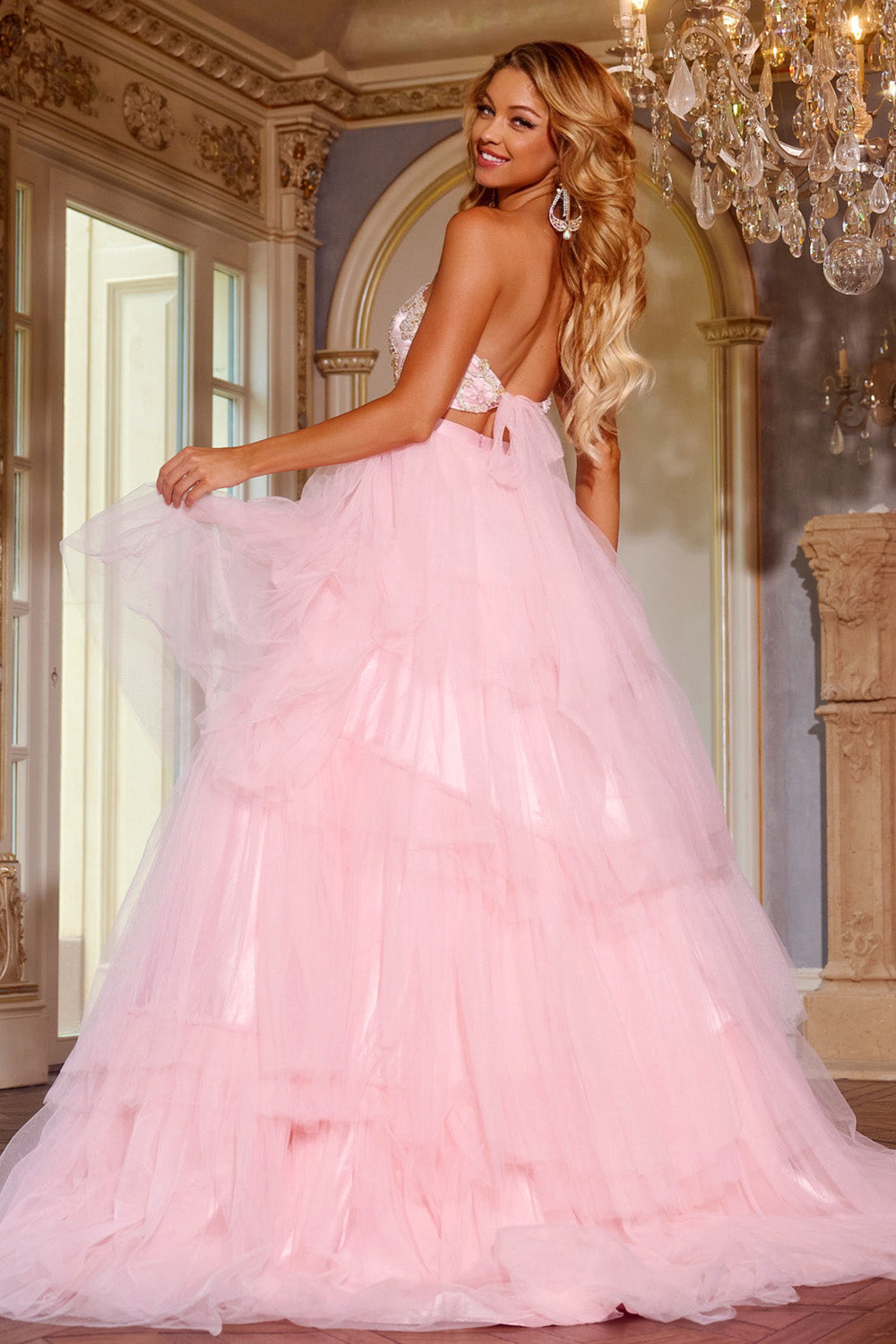 Jovani D5112 Pink ballgown prom dress with a lace-up back and layered tulle skirt, back view.