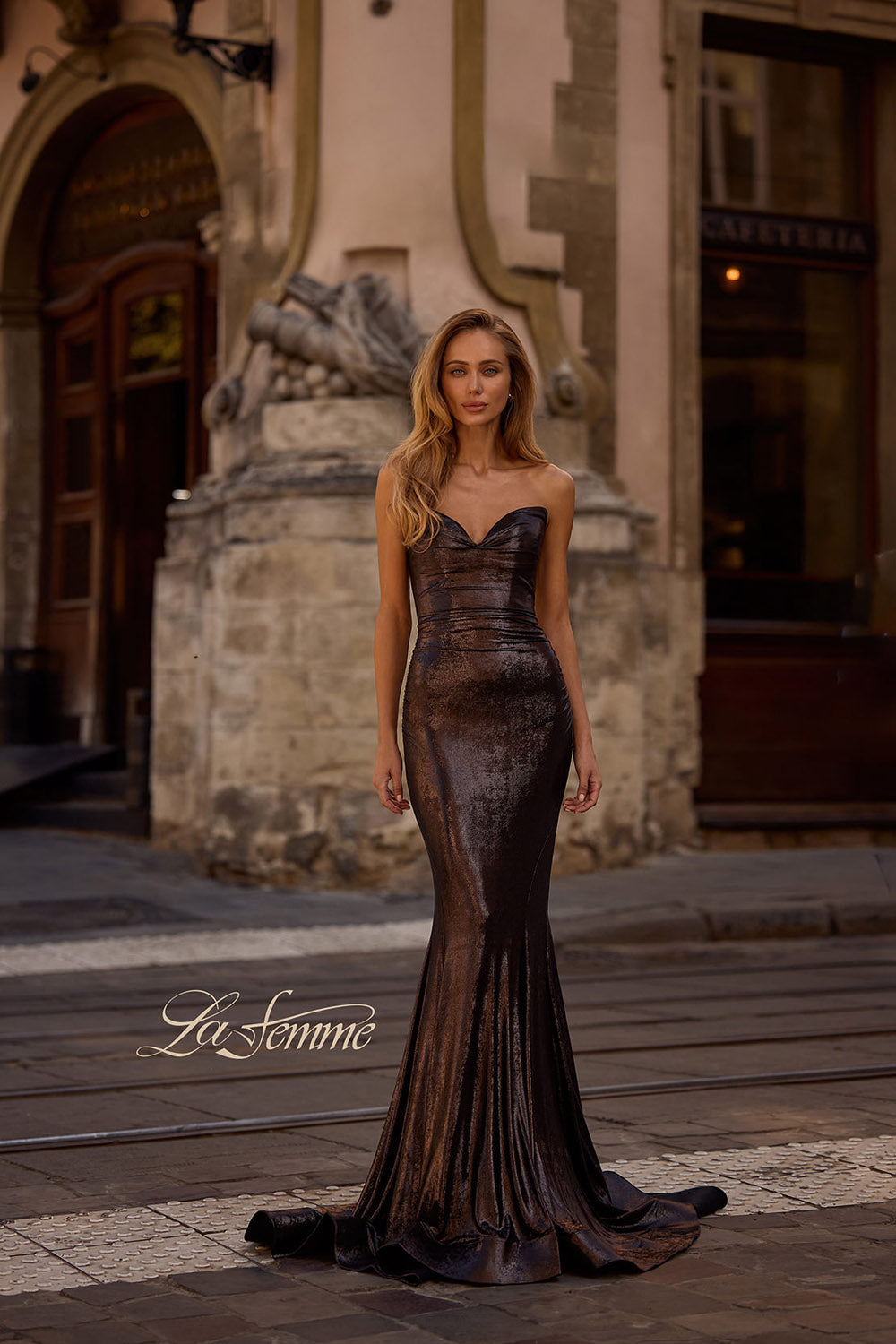 La Femme 32995 prom dress images. La Femme 32995 is available in these colors: Bronze, Dark Teal, Indigo, Mocha, Purple.