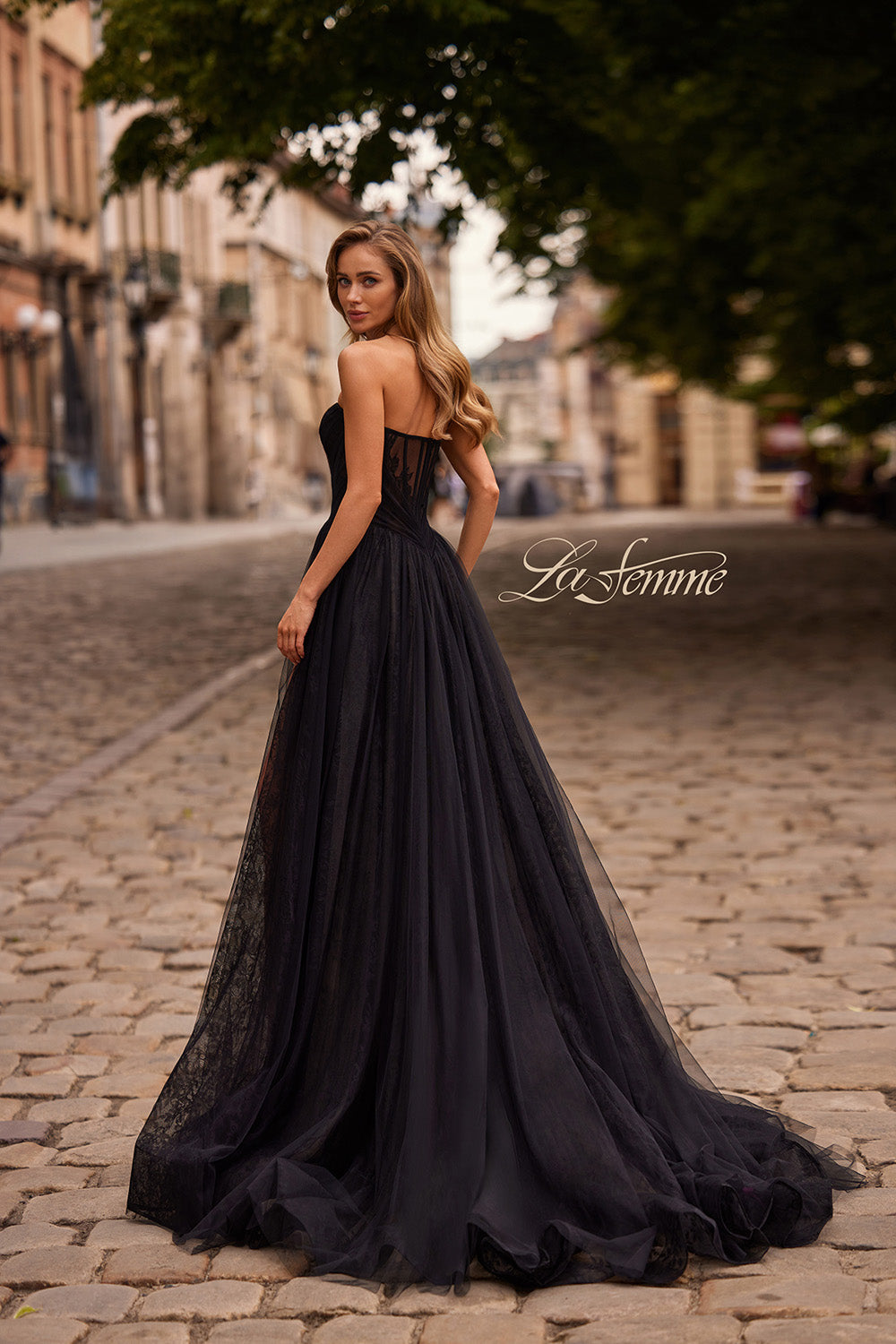 La Femme 33307 Black tulle prom dress with a fitted bodice and lace-up back, back view.