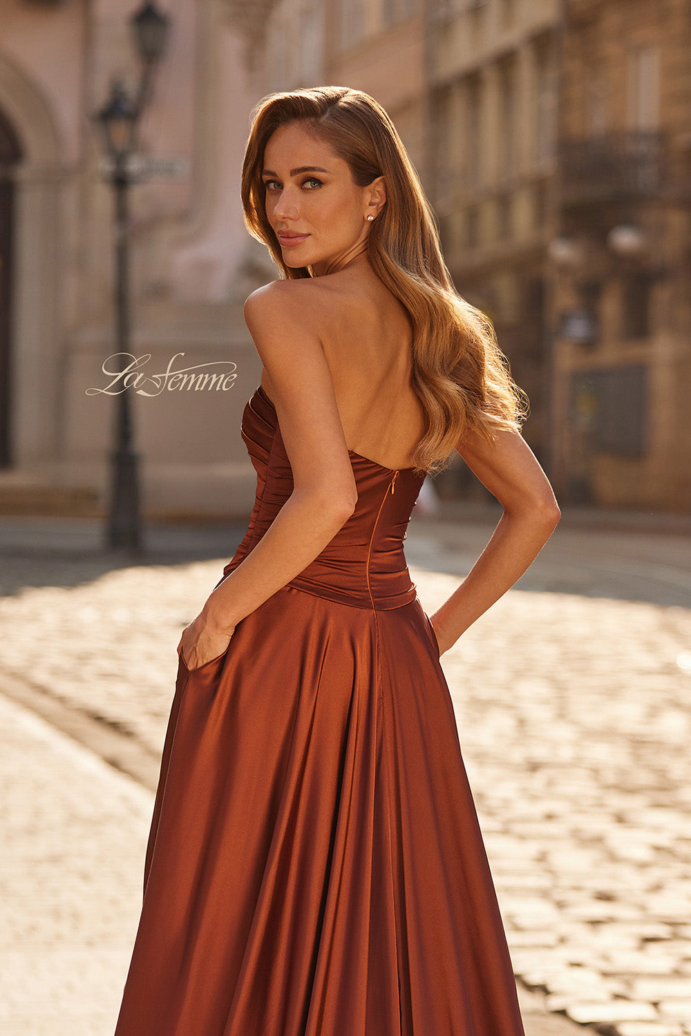 La Femme 33417 Copper satin prom dress with a fitted bodice and elegant lace-up back.