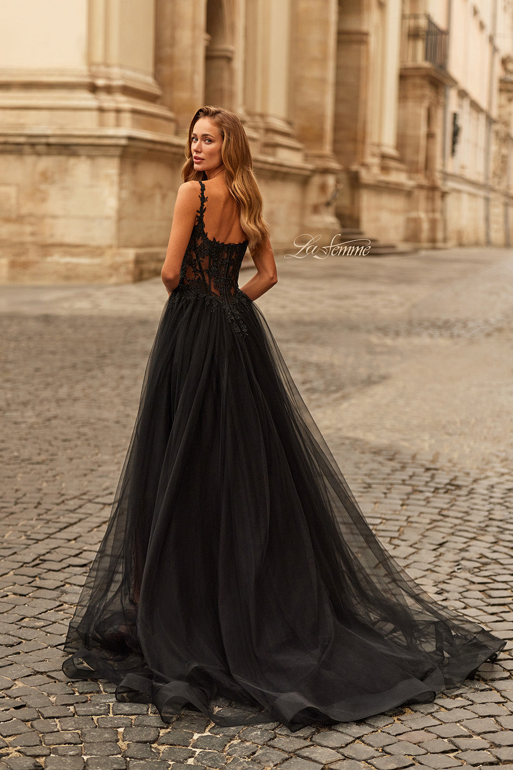 La Femme 33499 Black lace tulle prom dress with a fitted bodice and flowing skirt, back view.