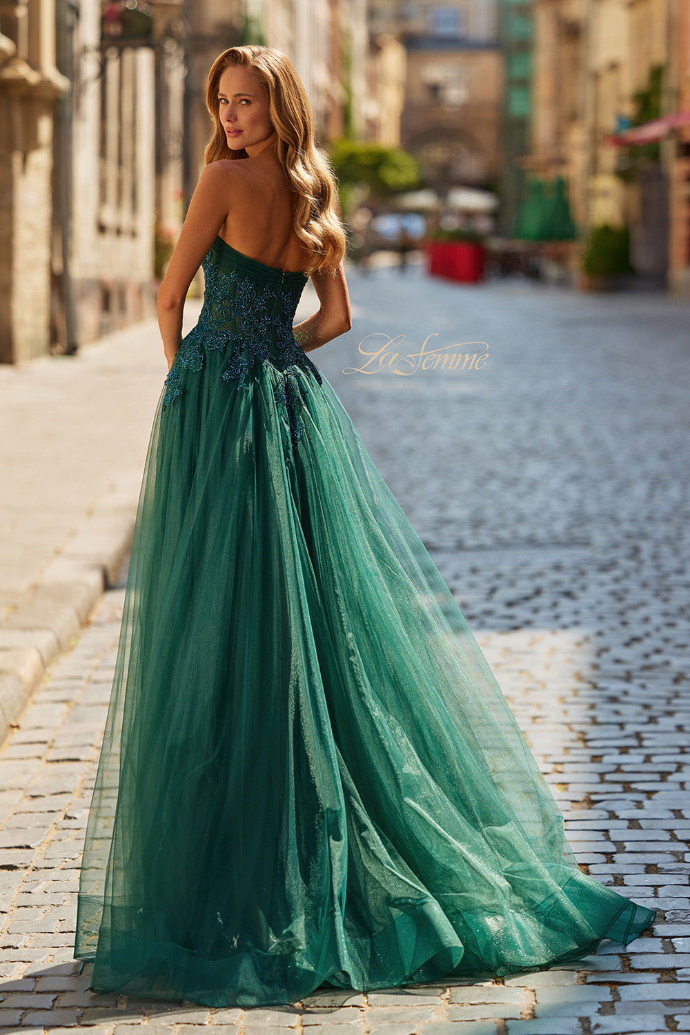 La Femme 33528 Dark emerald formal gown with lace bodice and flowing tulle skirt, back view.