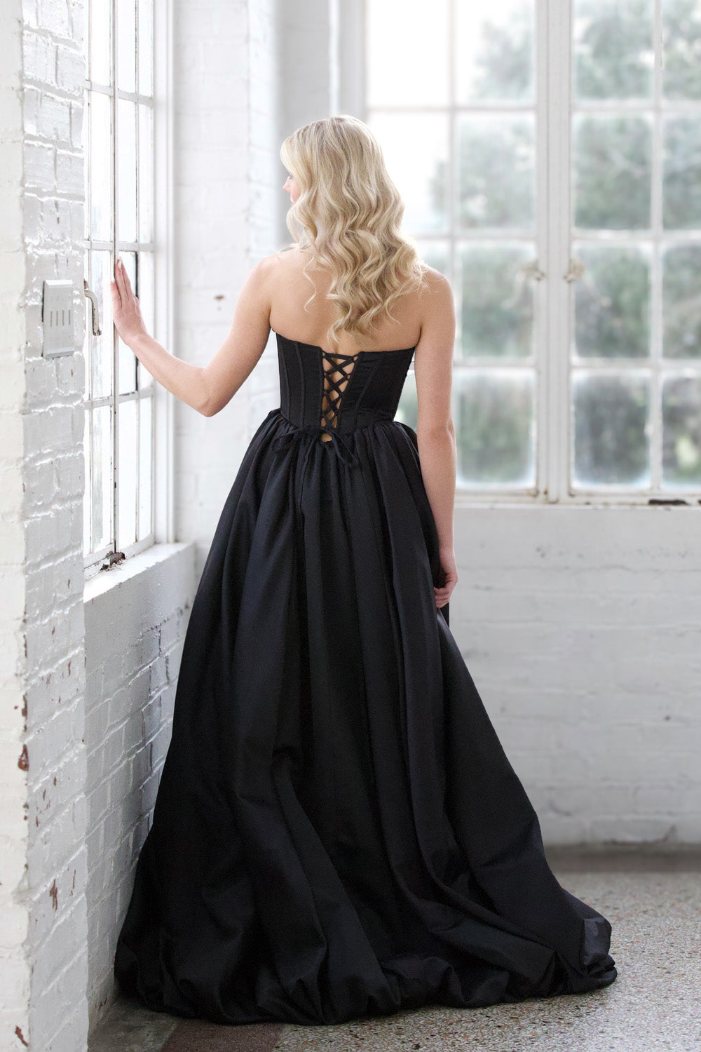 Miah Vega 24601 Black ballgown with a lace-up back, perfect for prom or formal events prom dress.
