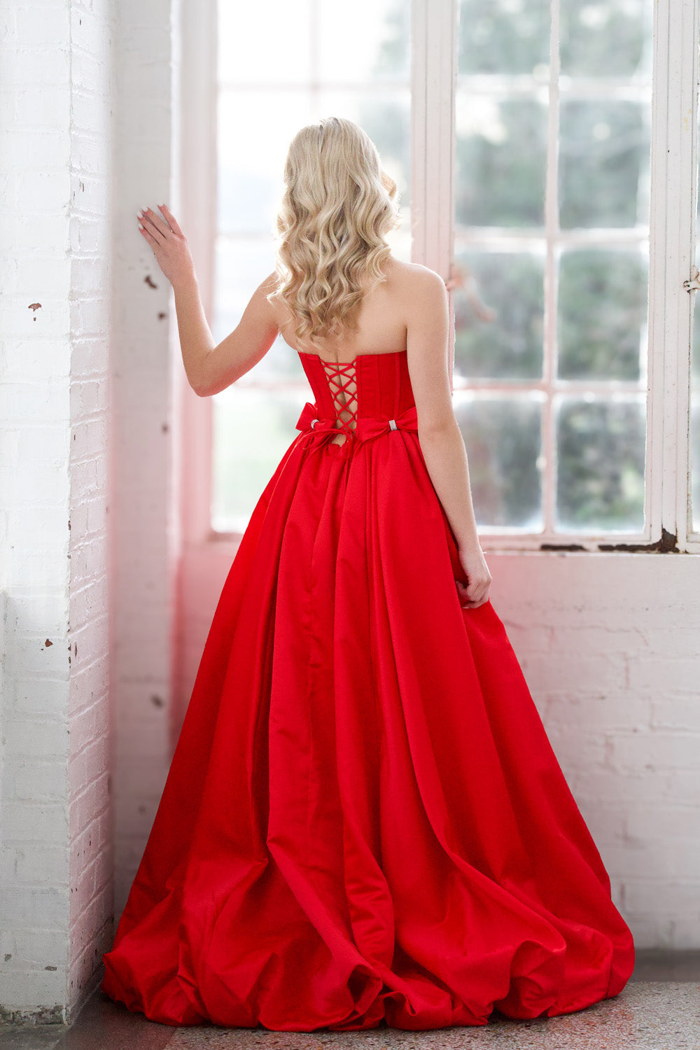 Miah Vega 24601 Red ballgown with a lace-up back, perfect for a stunning prom dress.
