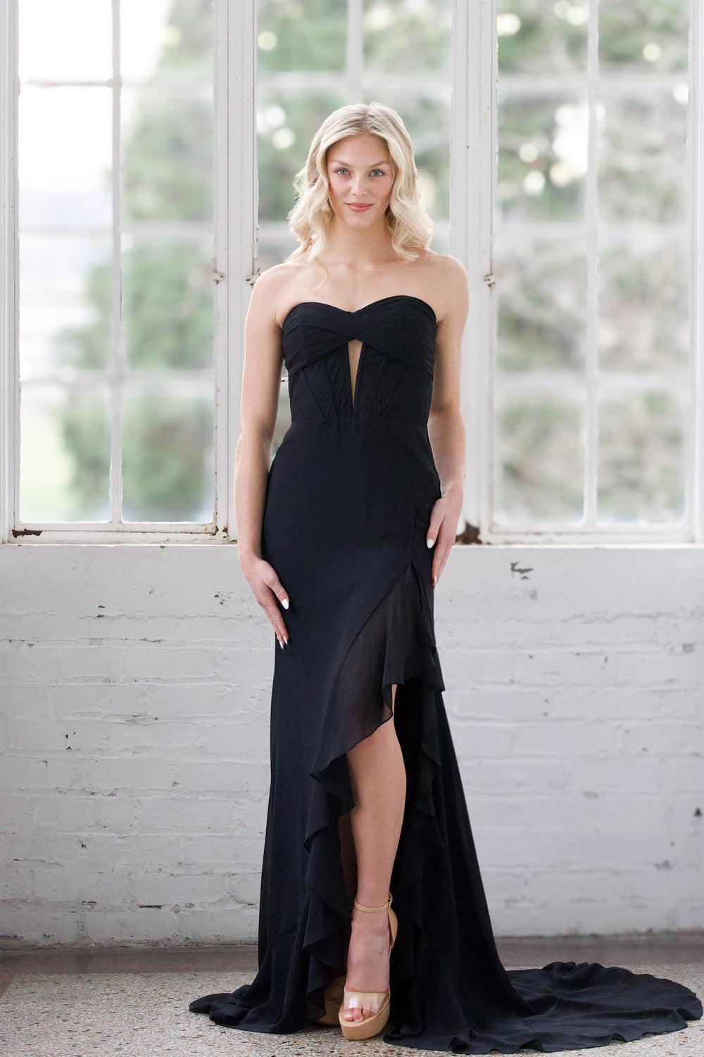 Miah Vega 24603 Black mermaid prom dress with a thigh-high slit and sweetheart neckline.