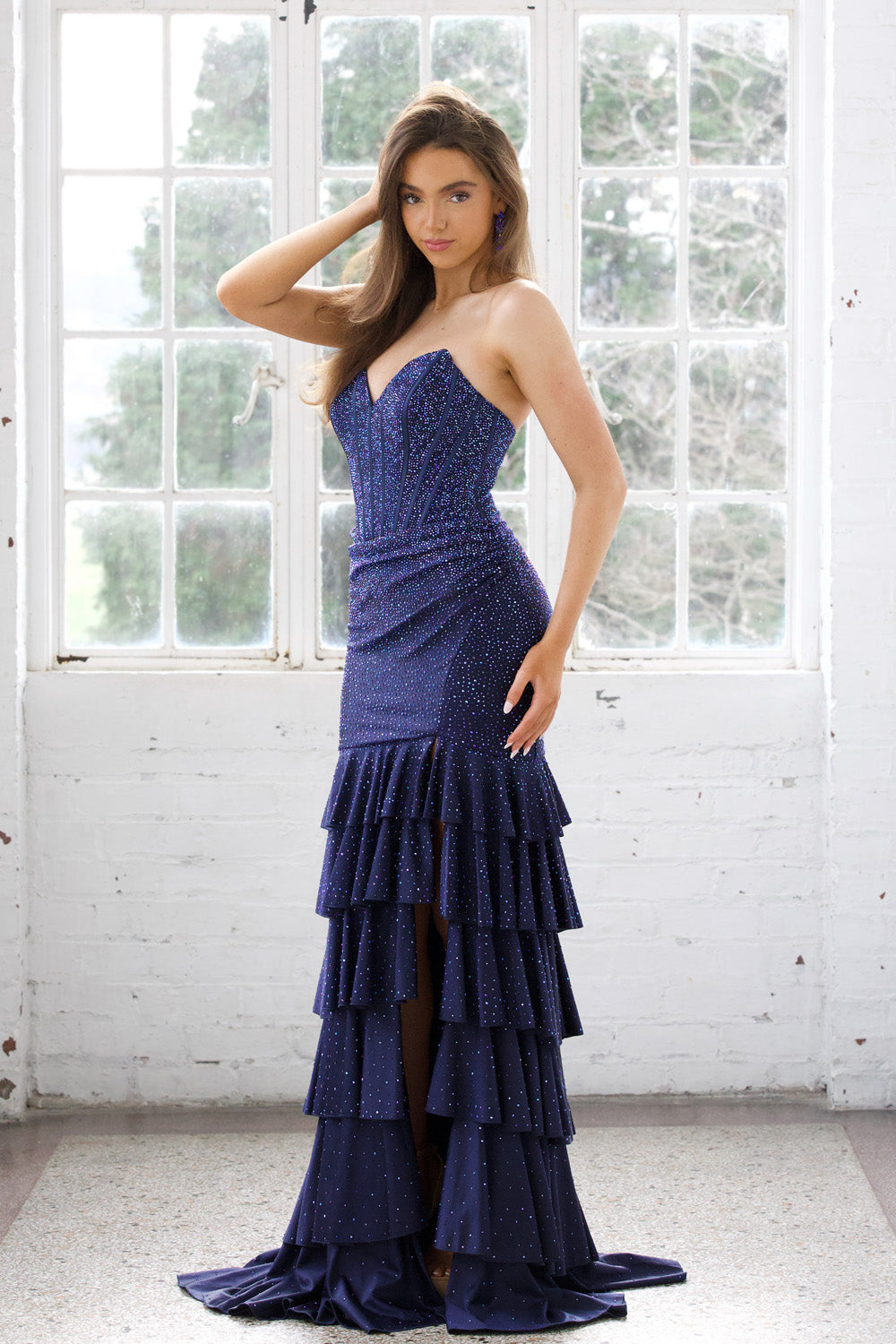 Miah Vega 24606 Navy mermaid prom dress with sequins and a thigh-high slit, front view.