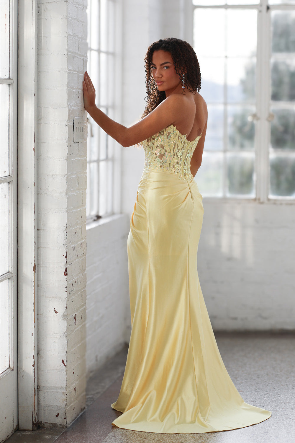 Miah Vega 24607 Yellow mermaid prom dress with intricate beading, back view.