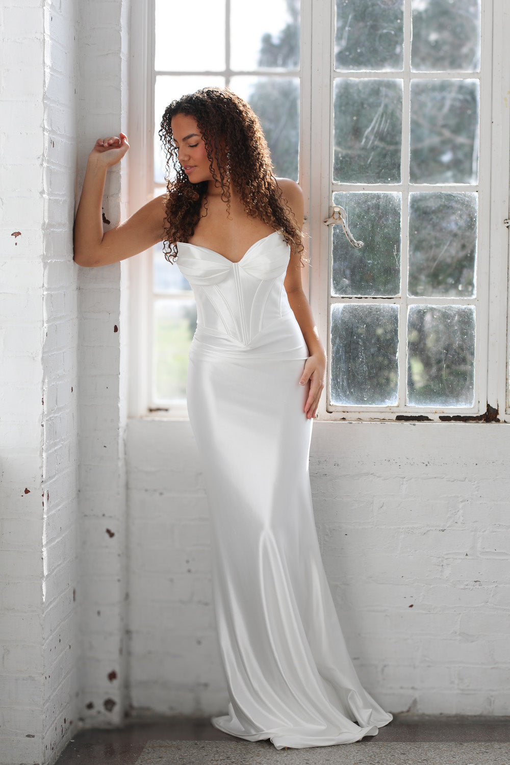 Miah Vega 24608 White fitted prom dress with sweetheart neckline and elegant mermaid silhouette.