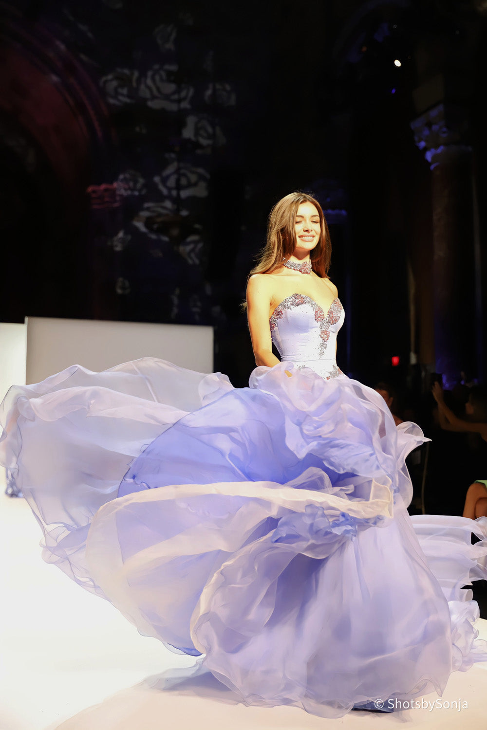 Sherri Hill 46406 periwinkle gown with silver and rose beaded basque waist and sweeping layered skirt in motion