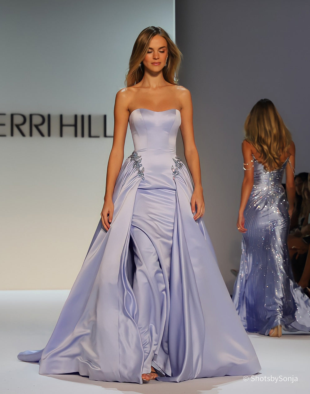 Sherri Hill 46705 periwinkle strapless satin ball gown with structured bodice and full overskirt from the front