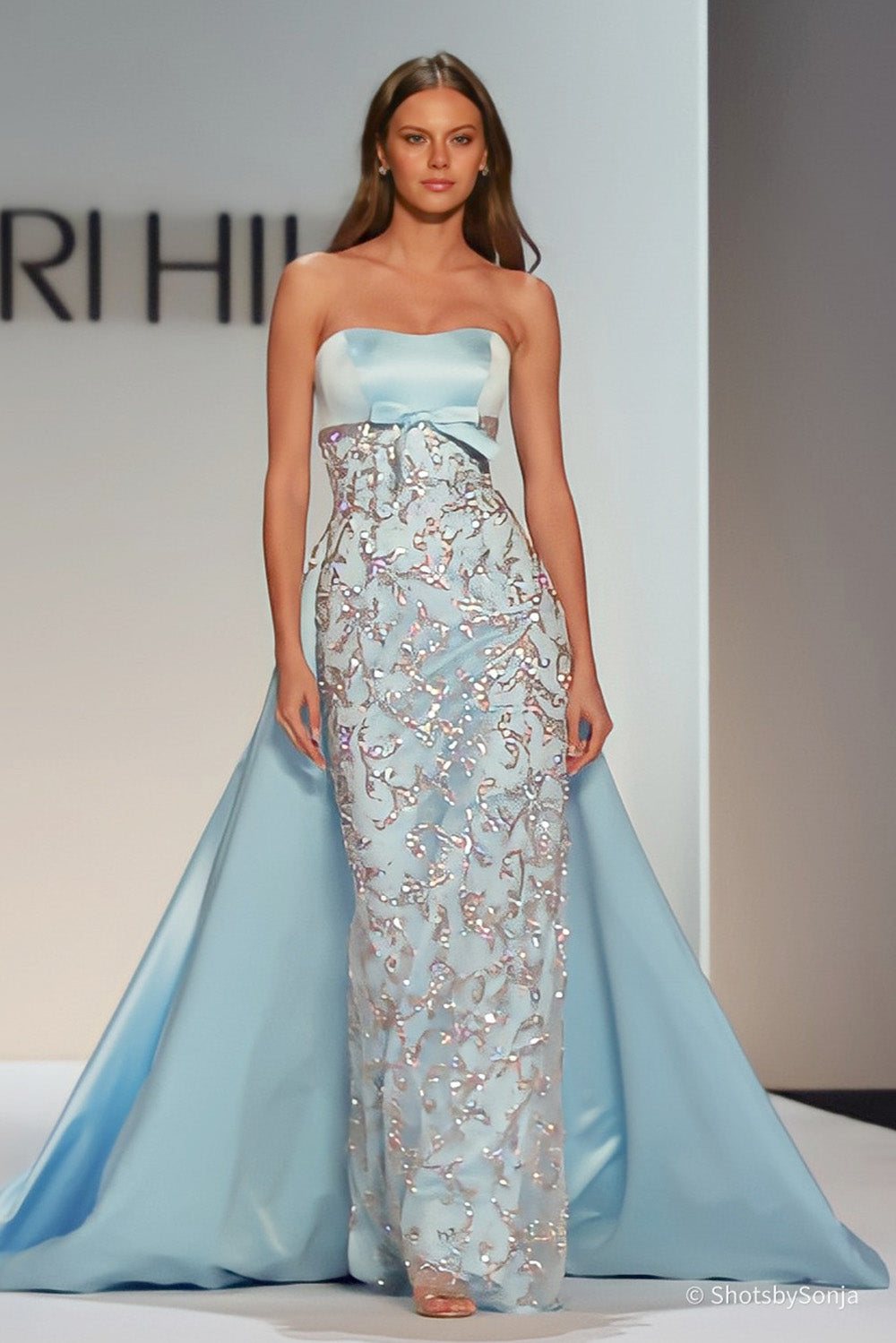 Sherri Hill 46743 light blue sweetheart neckline gown showing allover beaded applique and satin bow at waist
