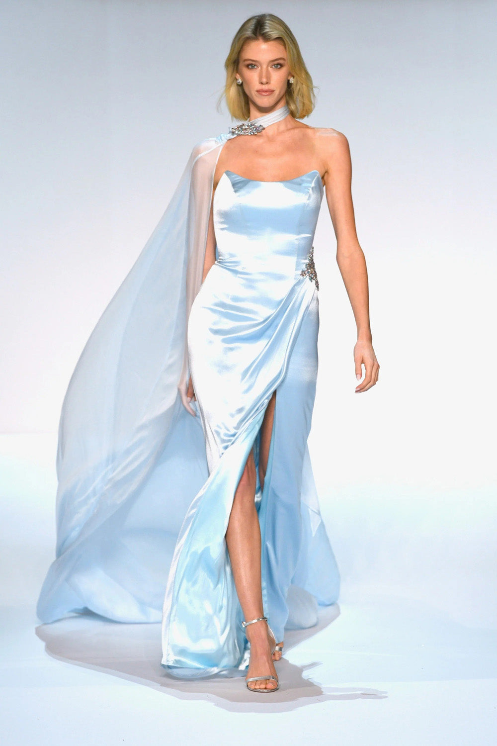 Sherri Hill 46757 light blue satin strapless gown with chiffon shoulder cape and beaded hip detail