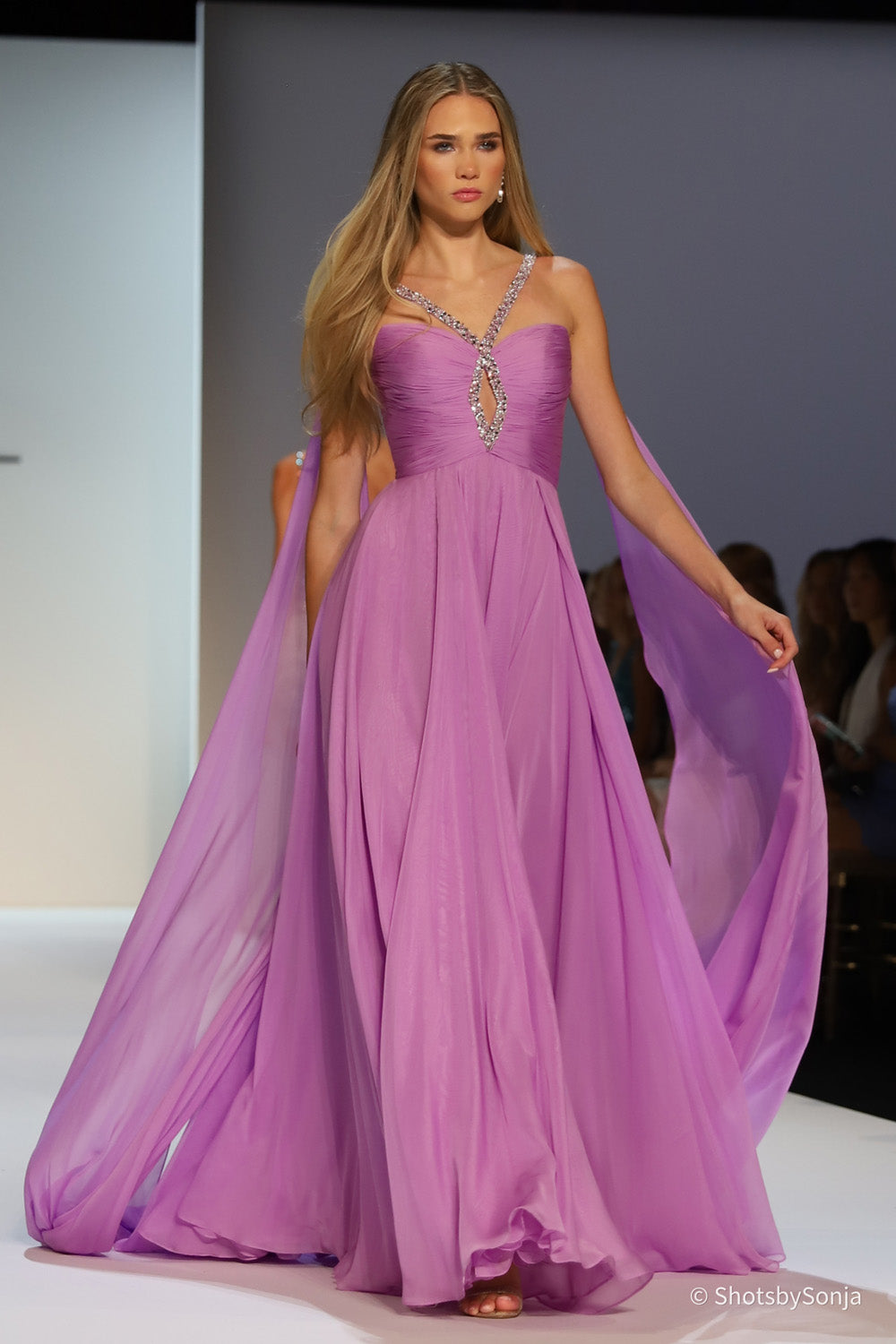Sherri Hill 58315 violet chiffon A-line gown with beaded keyhole neckline and flowing wing panels in motion
