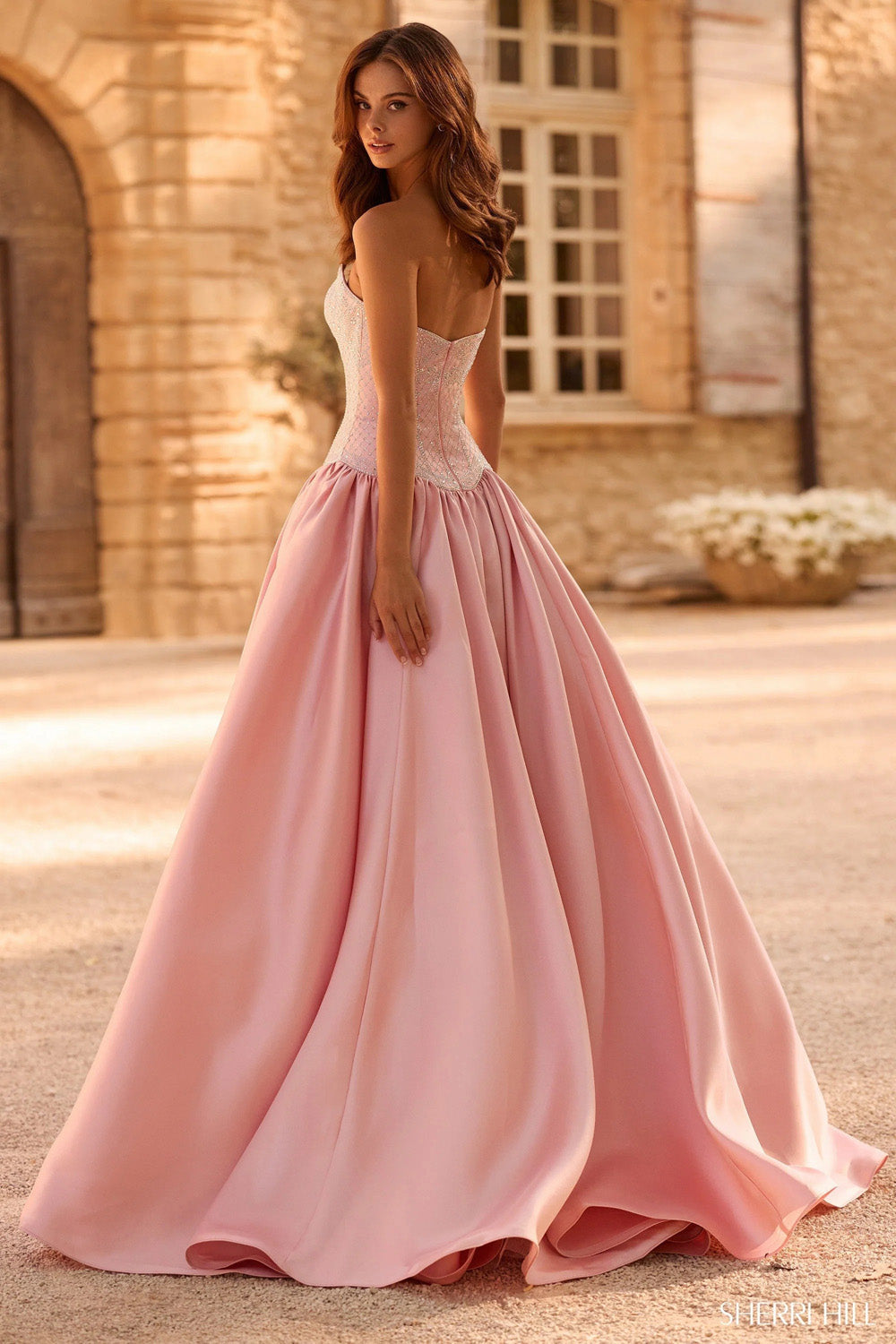 Sherri Hill 58522 blush silver back view showing boned corset and full satin ball gown skirt