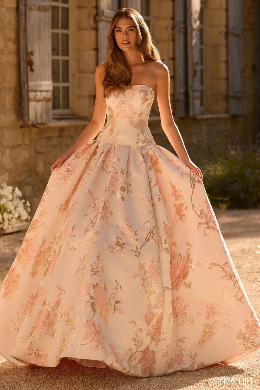 Sherri Hill 58594 blush print floral brocade strapless ballgown front view with full sweeping skirt and botanical print fabric