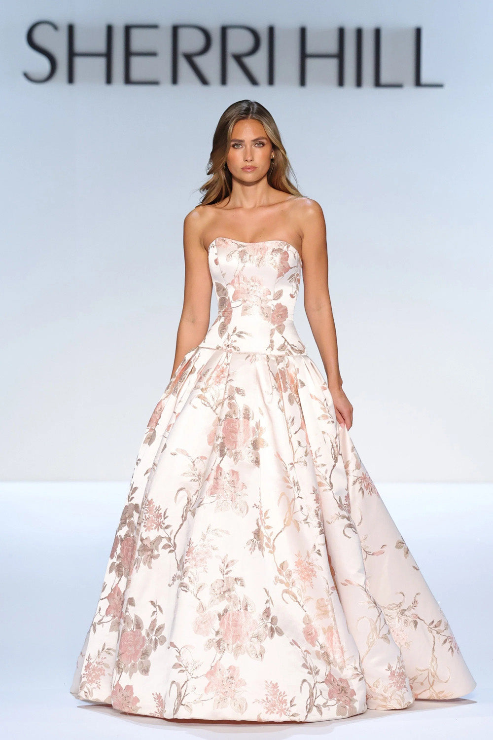 Sherri Hill 58594 blush print strapless floral brocade ballgown with panelled bodice and voluminous pleated skirt full view