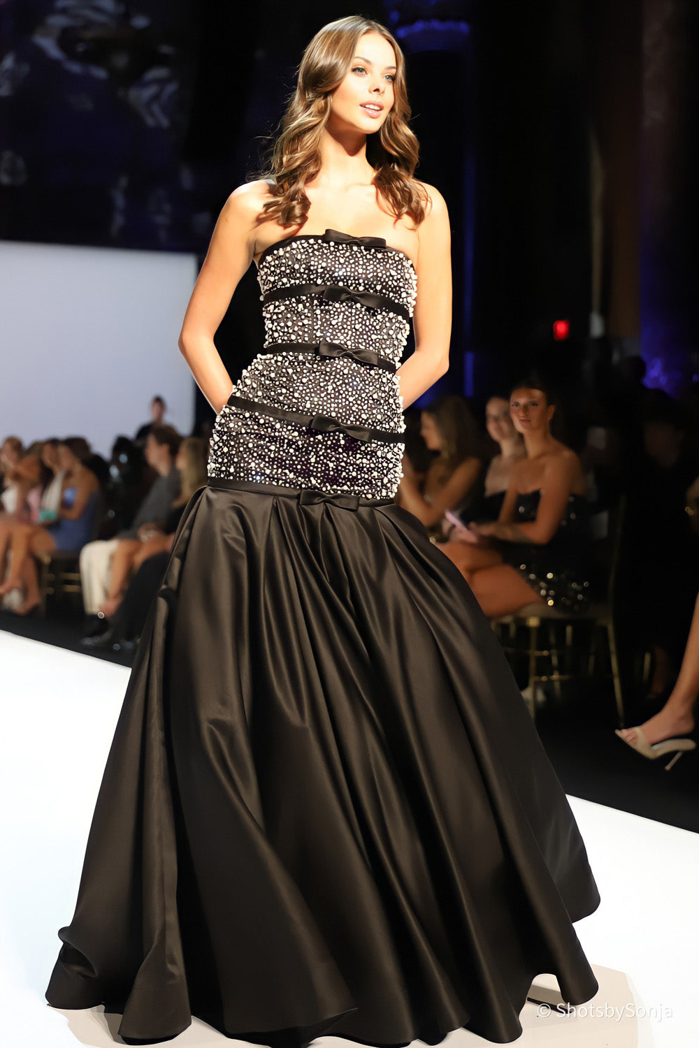 Sherri Hill 58929 black silver strapless beaded gown with horizontal ribbon bands and voluminous satin skirt