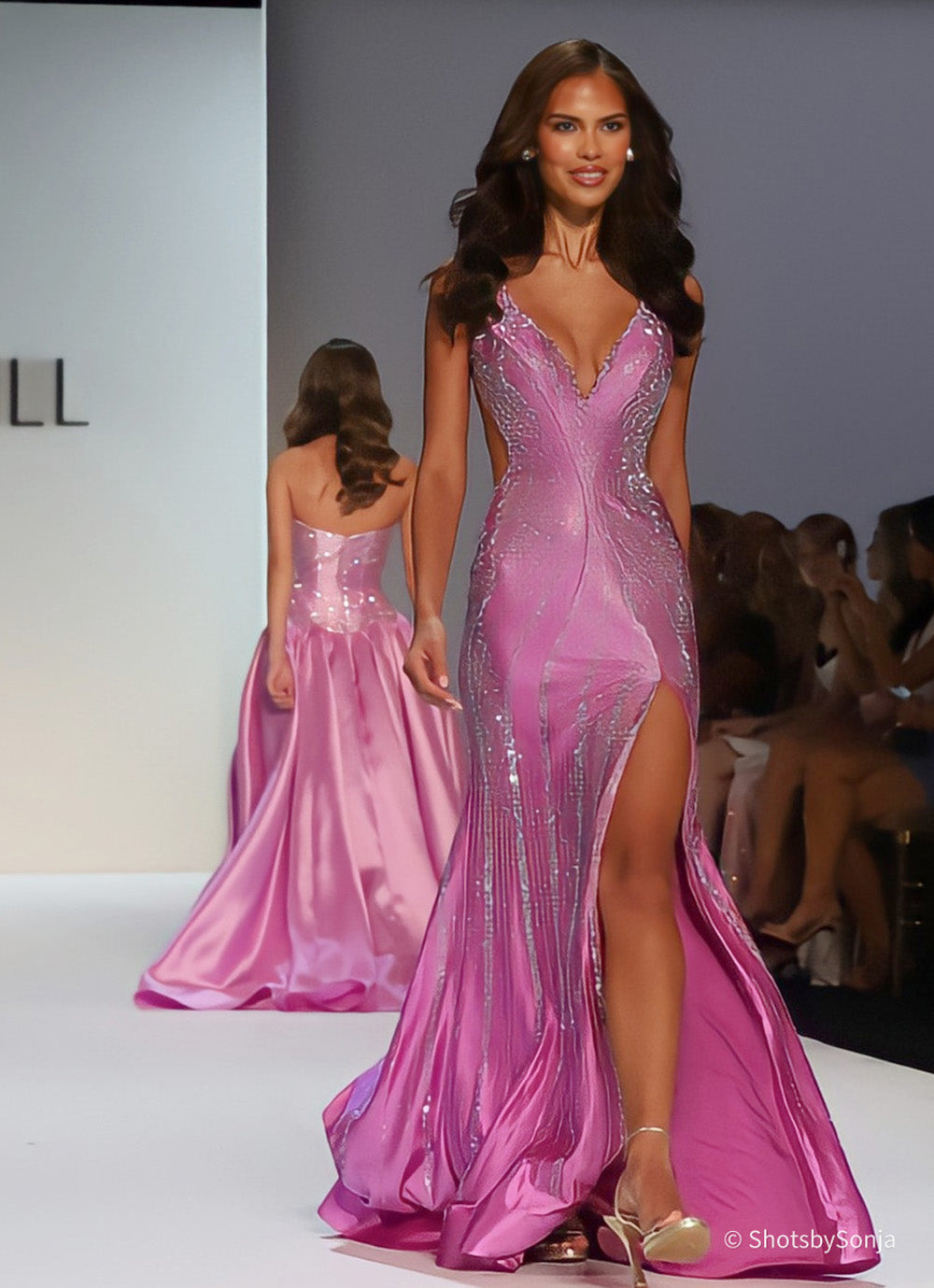 Sherri Hill 58939 violet embellished mermaid dress with deep V neckline and front slit, mid-walk runway view