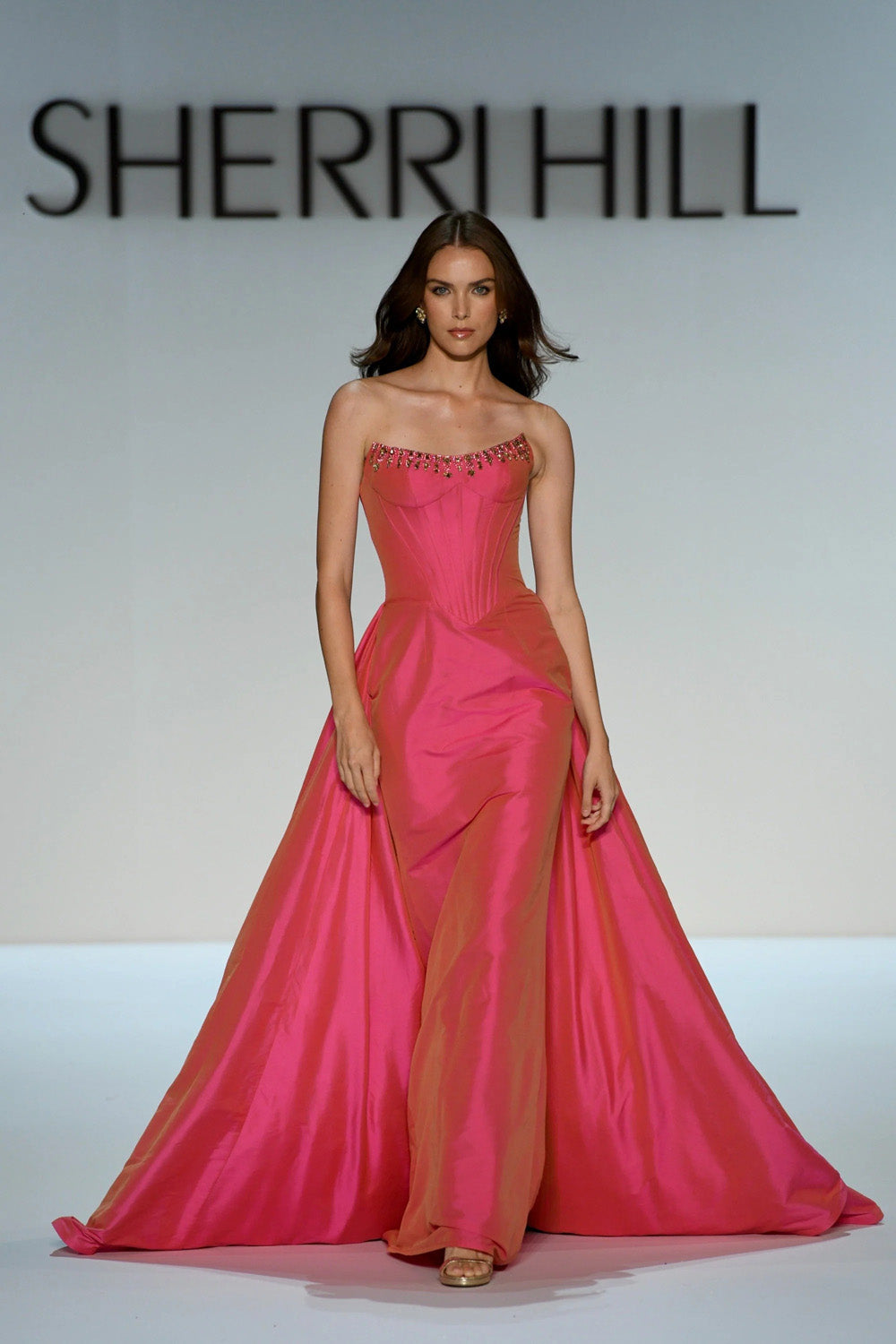Sherri Hill 67327 in fuchsia, strapless corset ball gown with beaded neckline and voluminous draped skirt, full length