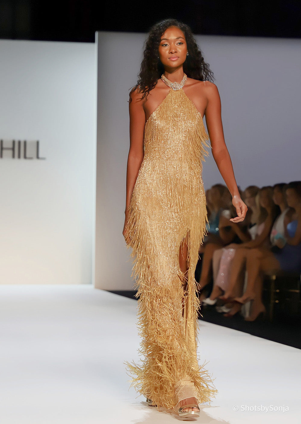 Sherri Hill 67331 nude gold beaded fringe halter gown full length front view showing tiered fringe and front slit