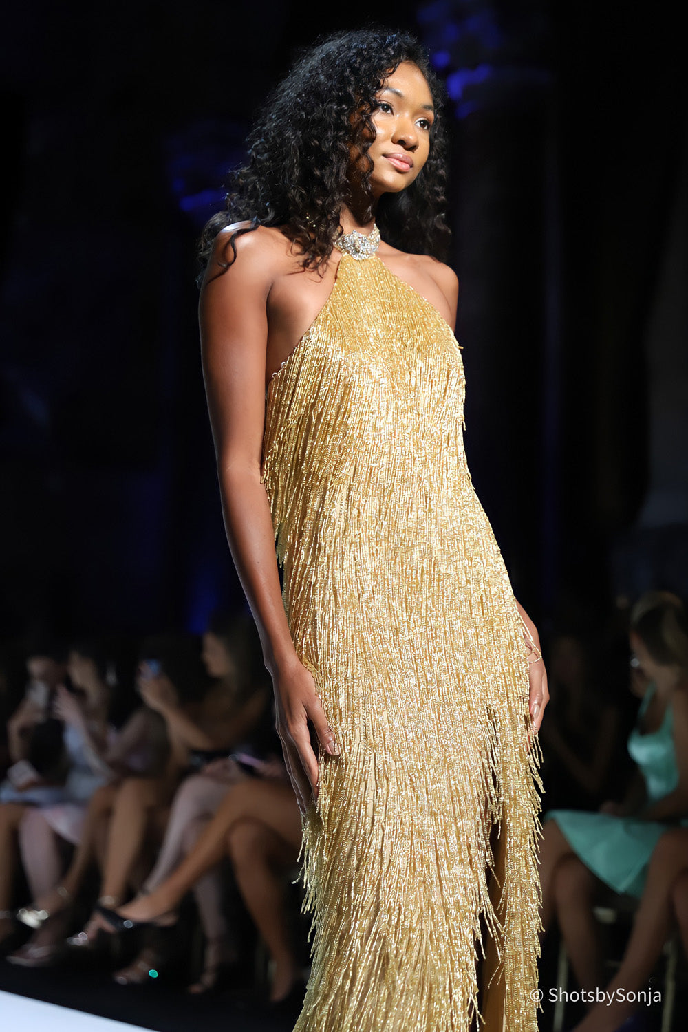 Sherri Hill 67331 nude gold beaded fringe halter gown side angle showing open back and vertical fringe detail
