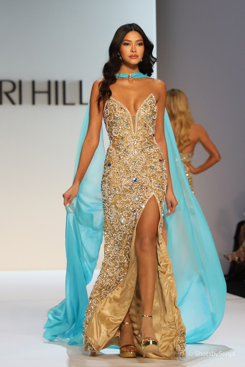 Sherri Hill 67348 gold beaded mermaid gown with aqua chiffon halter drape and deep sweetheart neckline front view