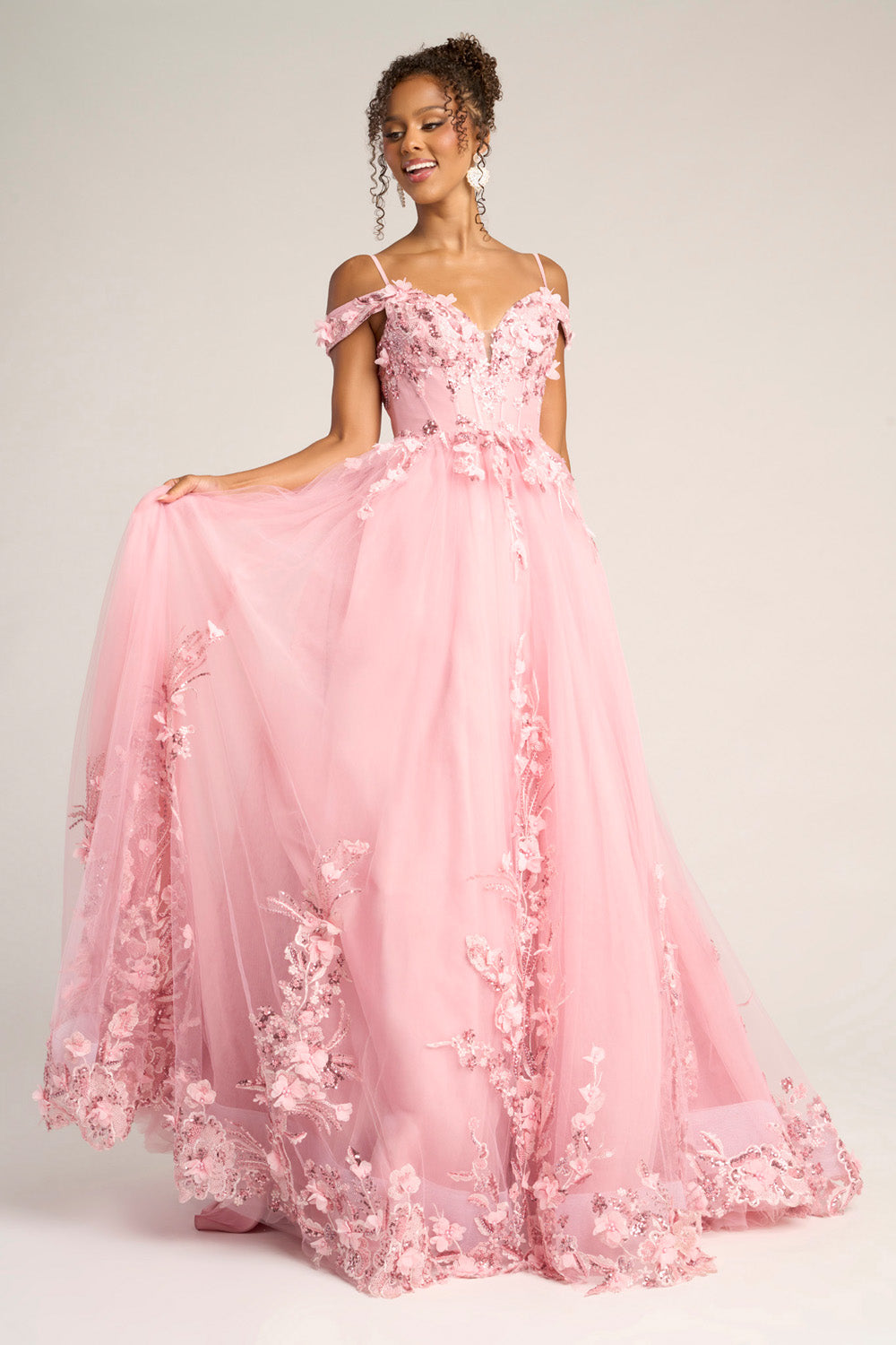 Portia and Scarlett PS26055 Pink A-line prom dress with floral appliqué and off-the-shoulder straps.