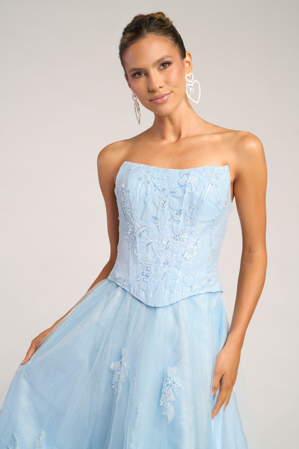 Portia and Scarlett PS26061 Light blue prom dress with a fitted bodice and intricate beading, front view.