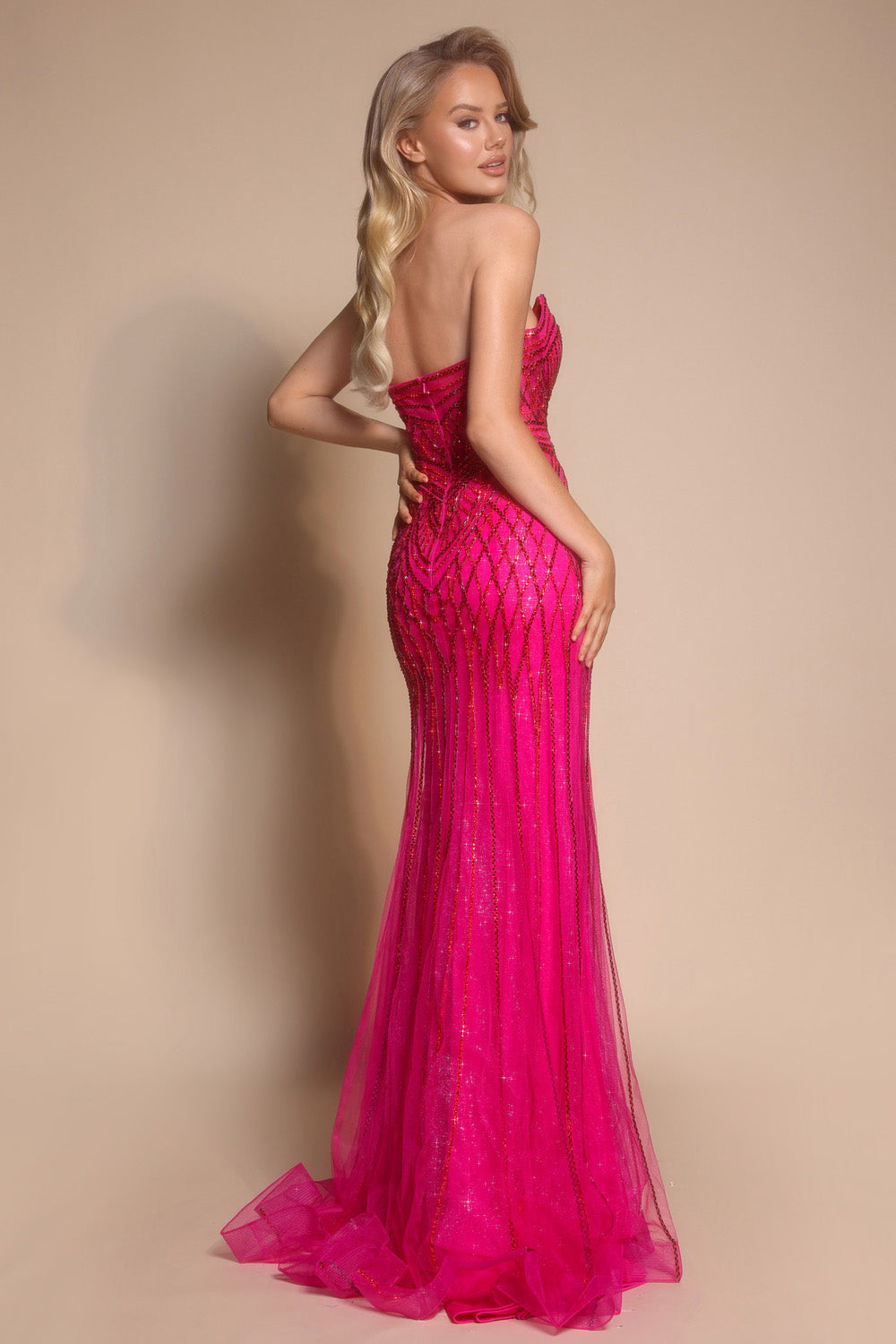Portia and Scarlett PS26072 Fuchsia mermaid prom dress with sparkling beading, back view.
