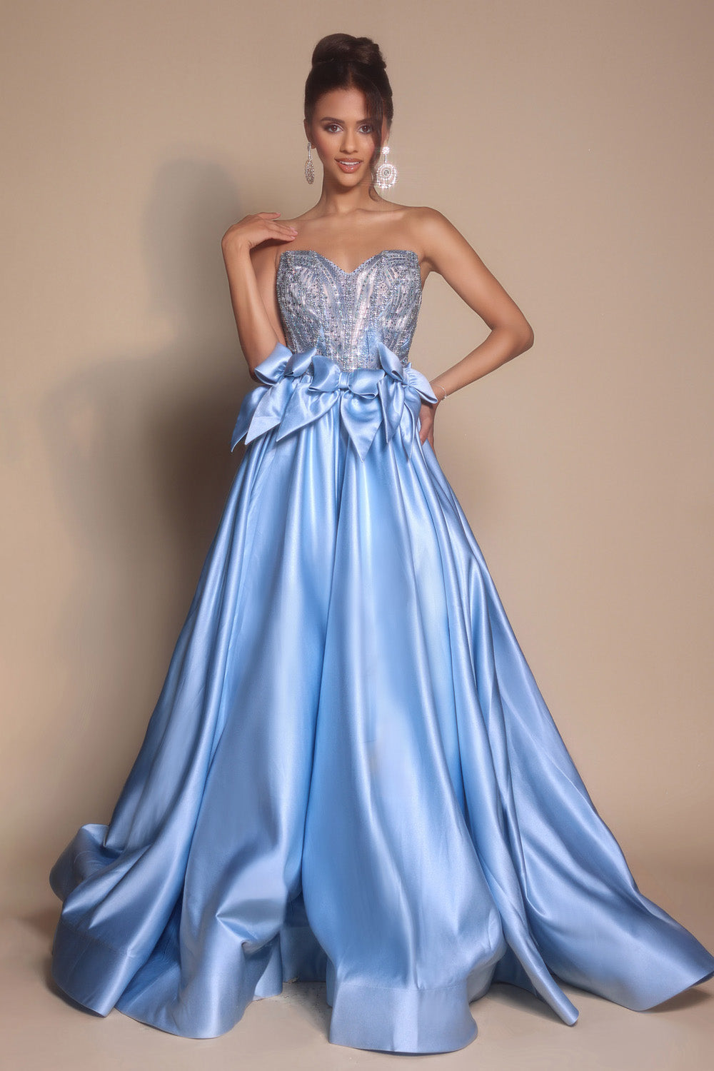 Portia and Scarlett PS26077 Strapless ocean prom dress with beaded bodice and flowing ballgown silhouette.