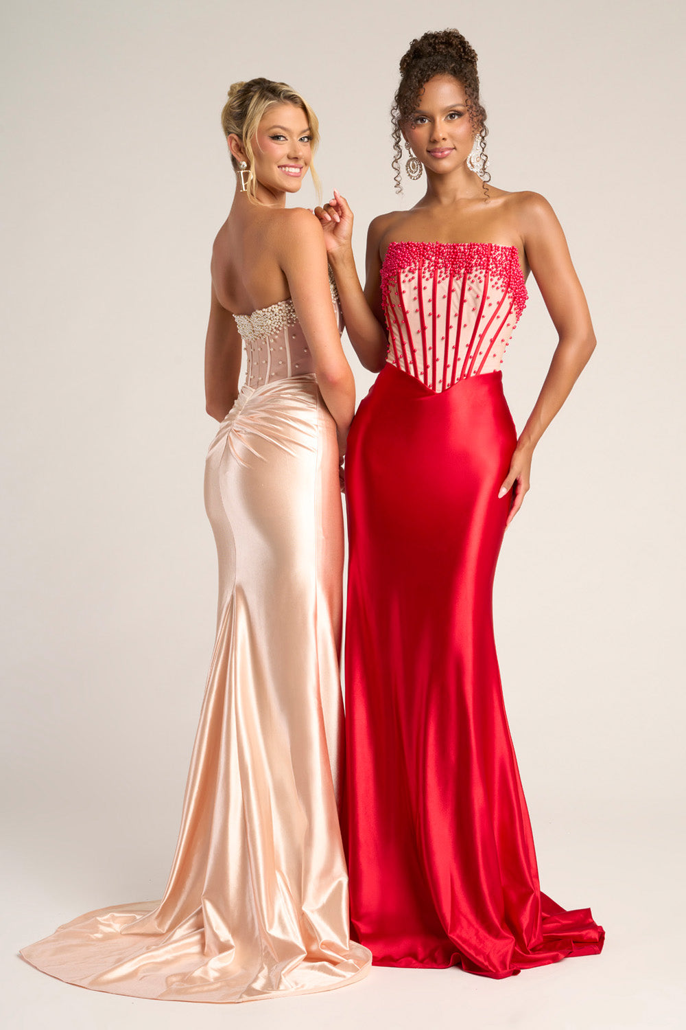 Portia and Scarlett PS26094 Red mermaid prom dress with beaded corset and elegant train, back view.