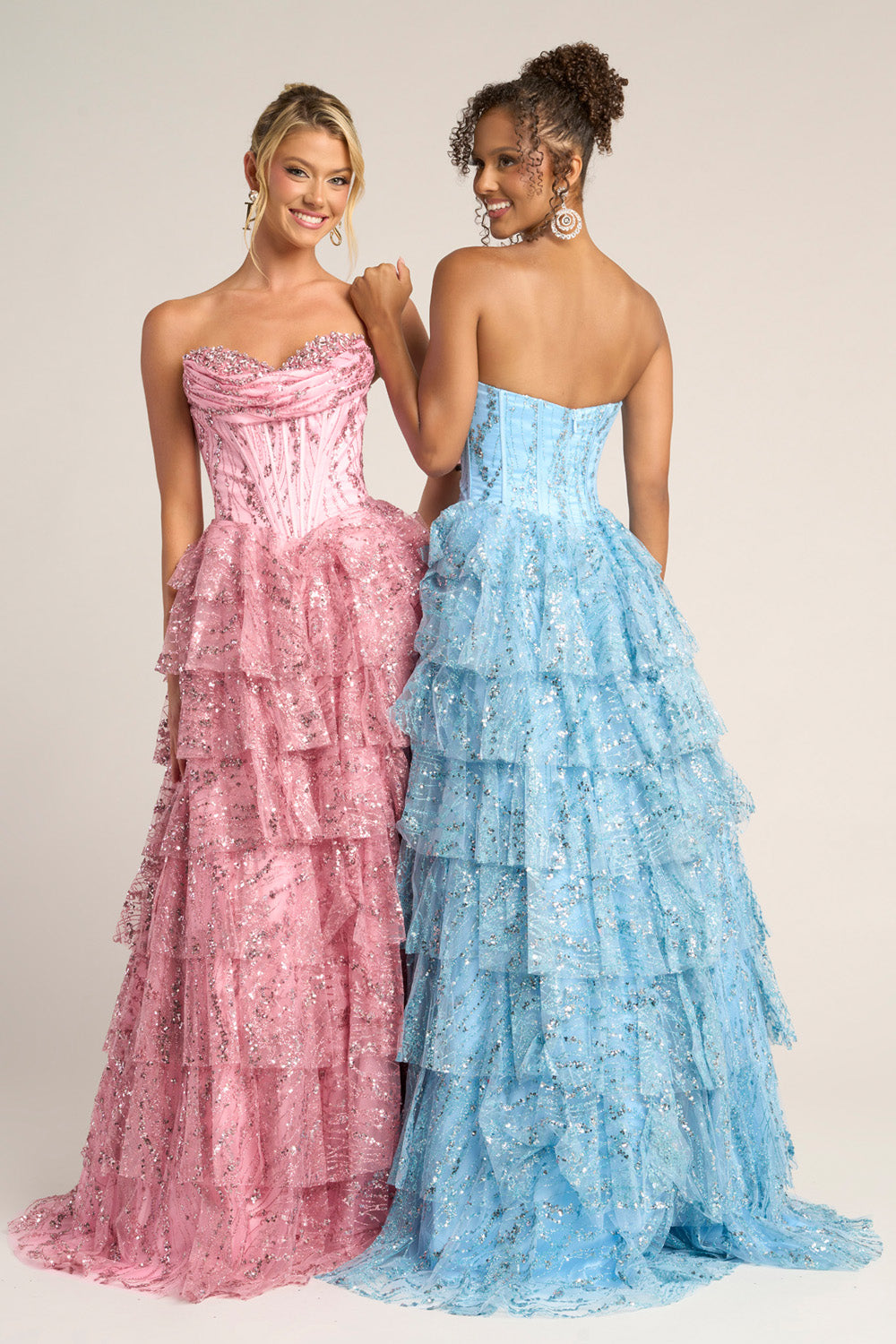 Portia and Scarlett PS26099 Pink and blue tiered prom dresses with sequins and strapless design, back view.